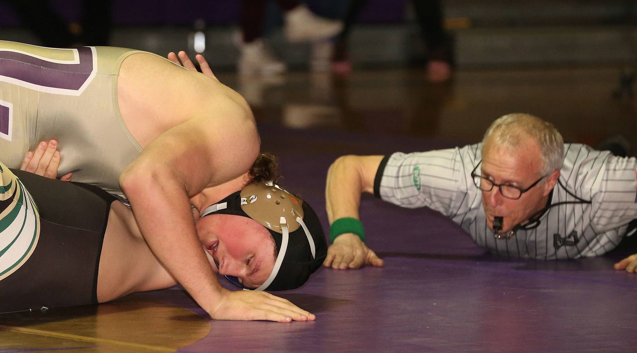Sam Zook pins Getchell’s Tyson Sawyer in the first minute of their match as official Tim Thon looks on. (Photo by John Fisken)