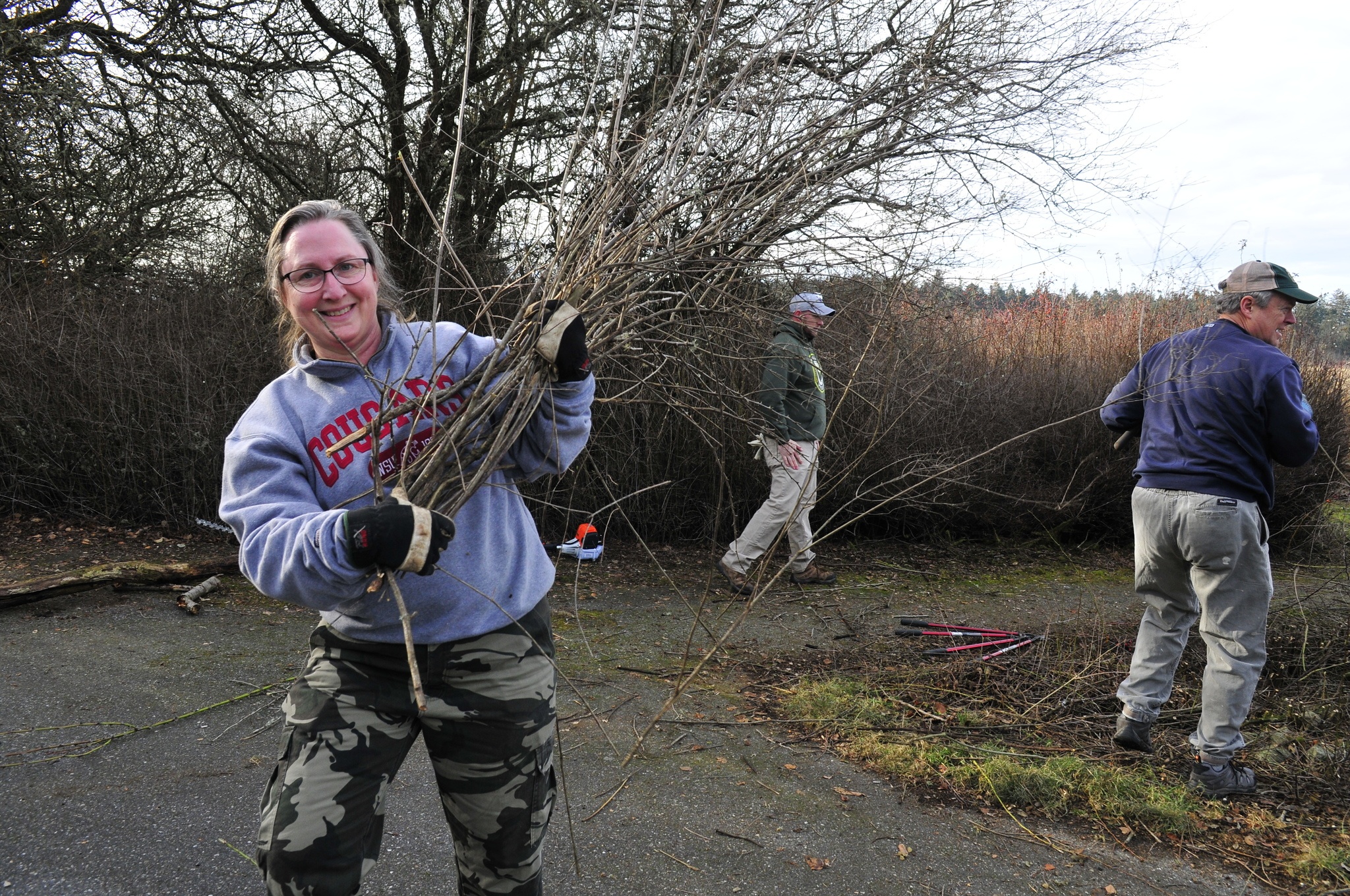 Valerie Matazzoni, a retired Navy veteran, participates in a veteran volunteer project along with the National Parks Conservation Association to help maintain the Prairie Wayside portion of Ebey’s Prairie in Coupeville Monday. Photo by Michael Watkins/Whidbey News-Times