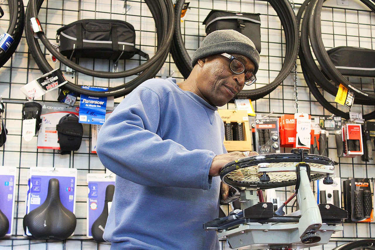 Dean Lewis tightens tennis racquet strings at his Oak Harbor shop, Dean’s SportsPlus, which has specialized in bicycles, repairs and other sports for nearly 30 years.                                Photo by Patricia Guthrie/Whidney News-Times
