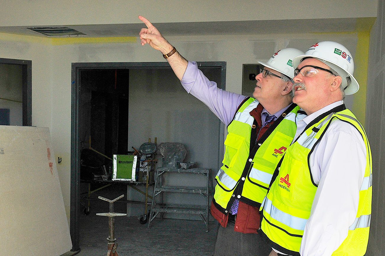 Photo by Michael Watkins/Whidbey News-Times Keith Mack, left, manager of marketing and community relations and George Senerth, executive director of facilities, both with Whidbey Health Medical Center, tour new construction of the hospital Monday in Coupeville.