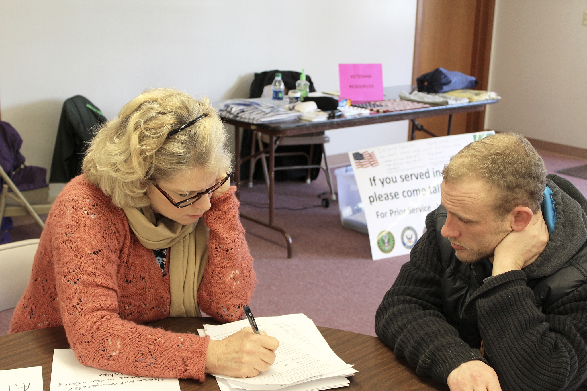 Dana Sawyers, coordinator for Island County Veterans Services, goes through a series of survey questions with veteran Wayne Martin. Photo by Patricia Guthrie/Whidbey News-Times