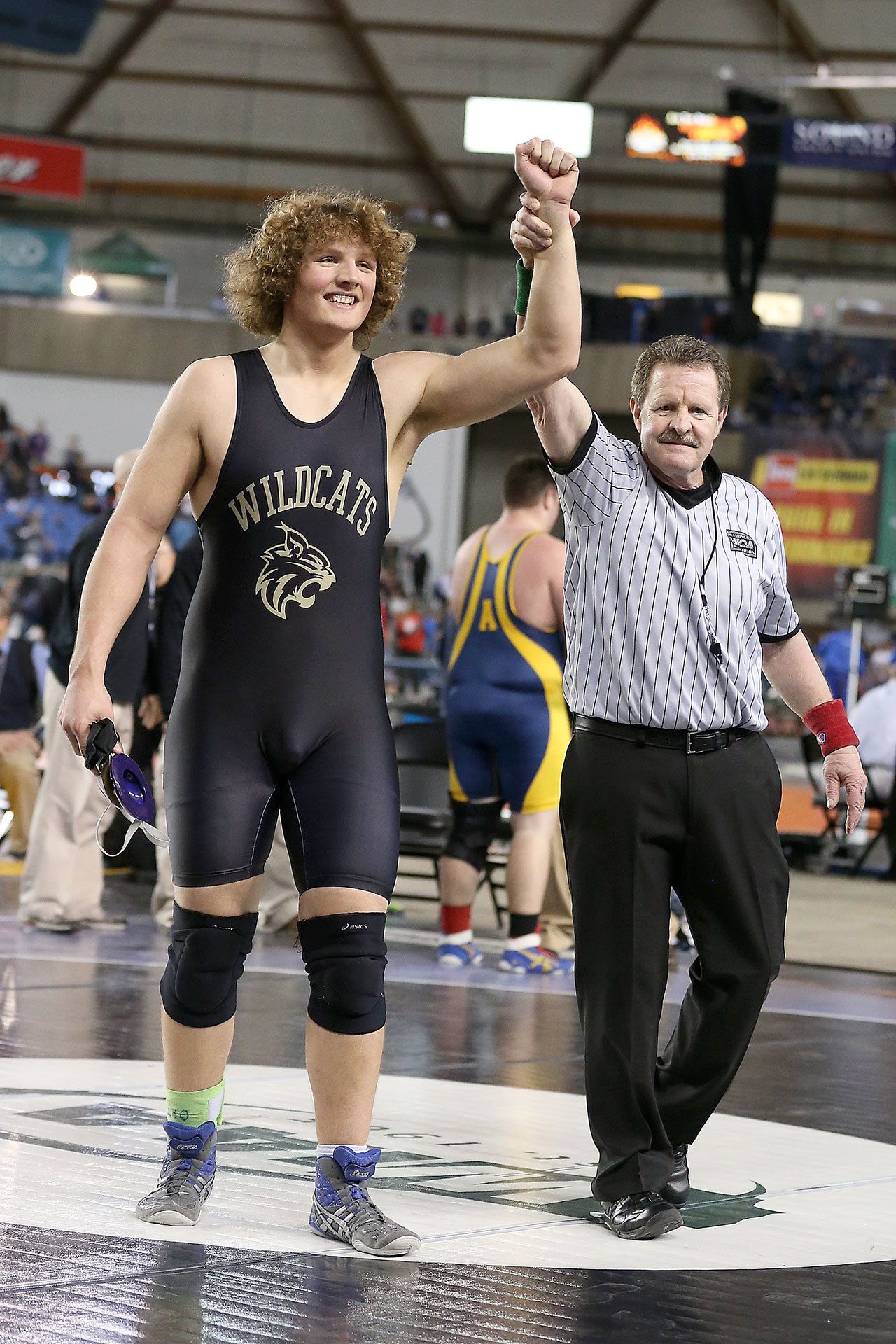 Oak Harbor High School senior Sam Zook is declared the winner of the state 285-pound 3A wrestling championship. (Photo by John Fisken)
