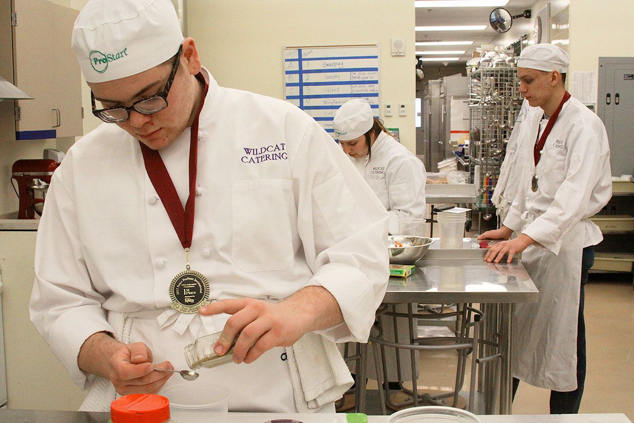 Donovan McCulley, foreground, and other Oak Harbor High School students work on preparing dishes during Chef Mary Arthuer’s culinary arts class Thursday, Feb. 23, 2017. The school’s culinary arts team won a state championship for the eighth time in 12 years on Saturday and will now advance to the National ProStart Invitational in Charleston, S.C. Photo by Ron Newberry/Whidbey News-Times