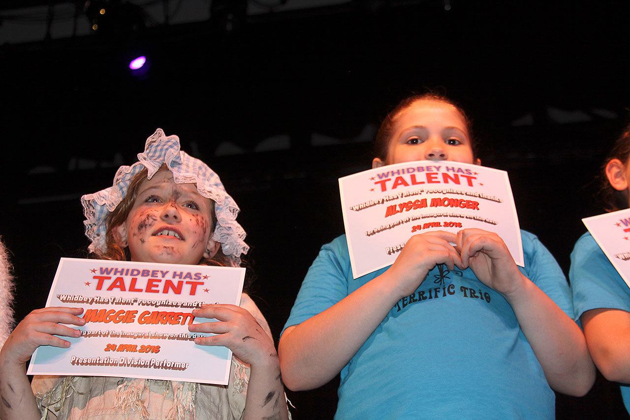 Maggie Garrett, left, and Alyssa Monger hold up certificates after participating in the first ‘Whidbey Has Talent’ at Oak Harbor High School last year. Photo by Ron Newberry/Whidbey News-Times