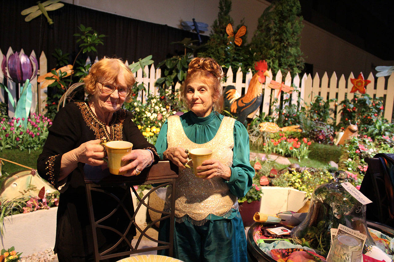 For more than 20 years, Vanca Lumsden of ALBE Rustics in Freeland (left) and Judith Jones of Fancy Fronds Nursery of Gold Bar have combined forces to create fanciful, fun displays at the annual Northwest Flower & Garden Show in Seattle. They’ve won Best of Show twice. Photo by Patricia Guthrie/Whidbey News-Times