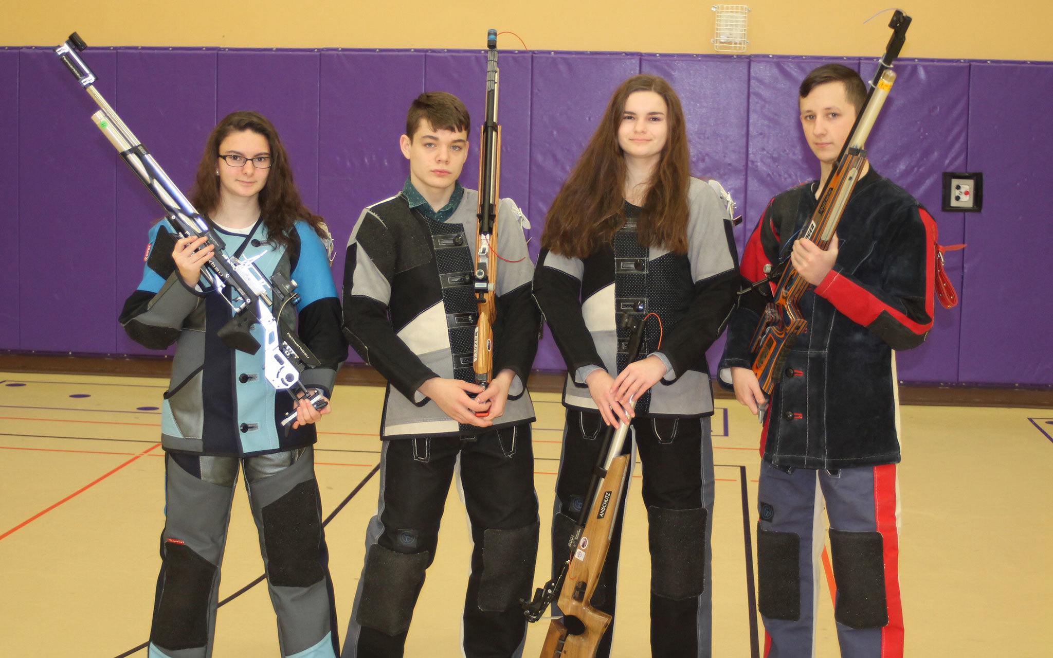 Elena Flake, left, Michael White, Julia Flake and Austin McBride will be joined by captain Mia Gehrmann in Alabama next week at the national Service Air Rifle Championships. (Photo by Jim Waller/Whidbey News/Times)