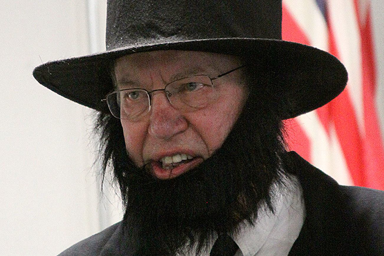 Alan Schell of Oak Harbor dresses up as Abraham Lincoln and impersonates the former U.S. president in the spirit of President’s Day Wednesday, Feb. 15, 2017 at Oak Harbor Christian School. Children from kindergarten through sixth grade attended the address. Photo by Ron Newberry/Whidbey News-Times