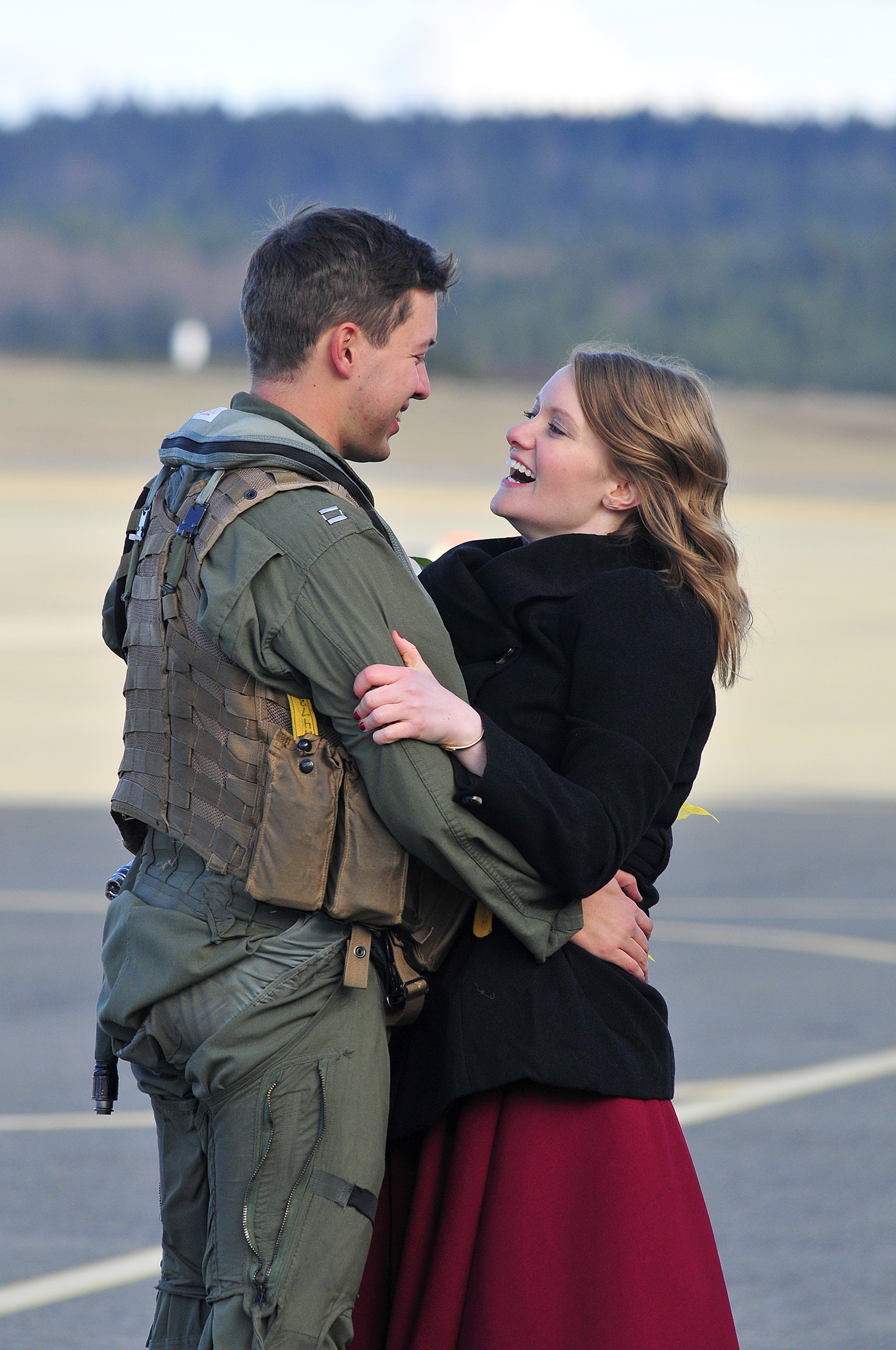 Lt. Chris Ihlan and his girlfriend Naomi Fosket are reunited at Naval Air Station Whidbey Island Dec. 30, 2016, after a six-month deployment overseas, just in time to celebrate New Years Eve. Photo by Michael Watkins/Whidbey News-Times