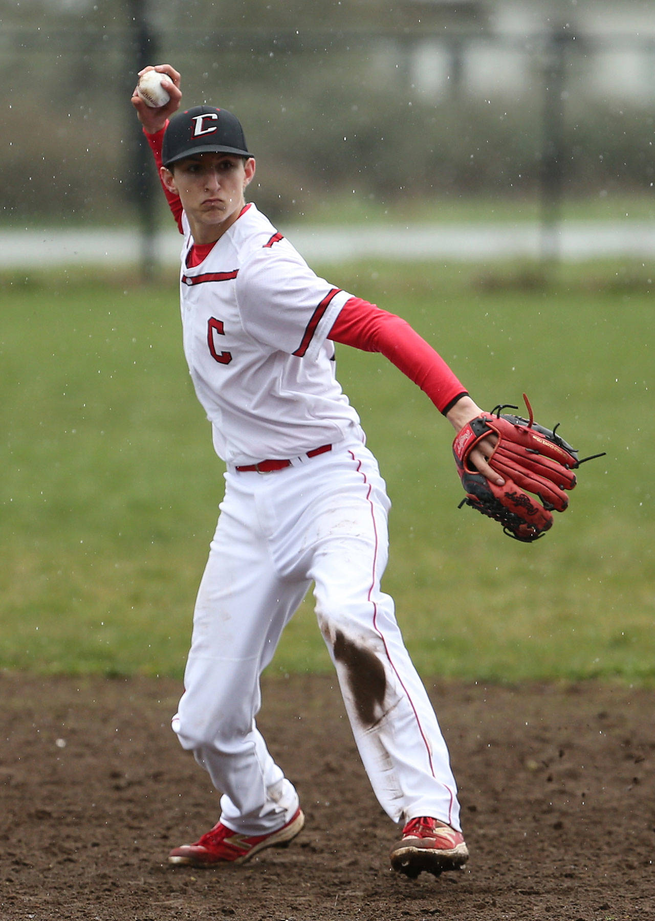 Joey Lippo throws to first for an out Saturday. The Coupeville defense played errorless ball behind pitcher Hunter Smith. (Photo by John Fisken)