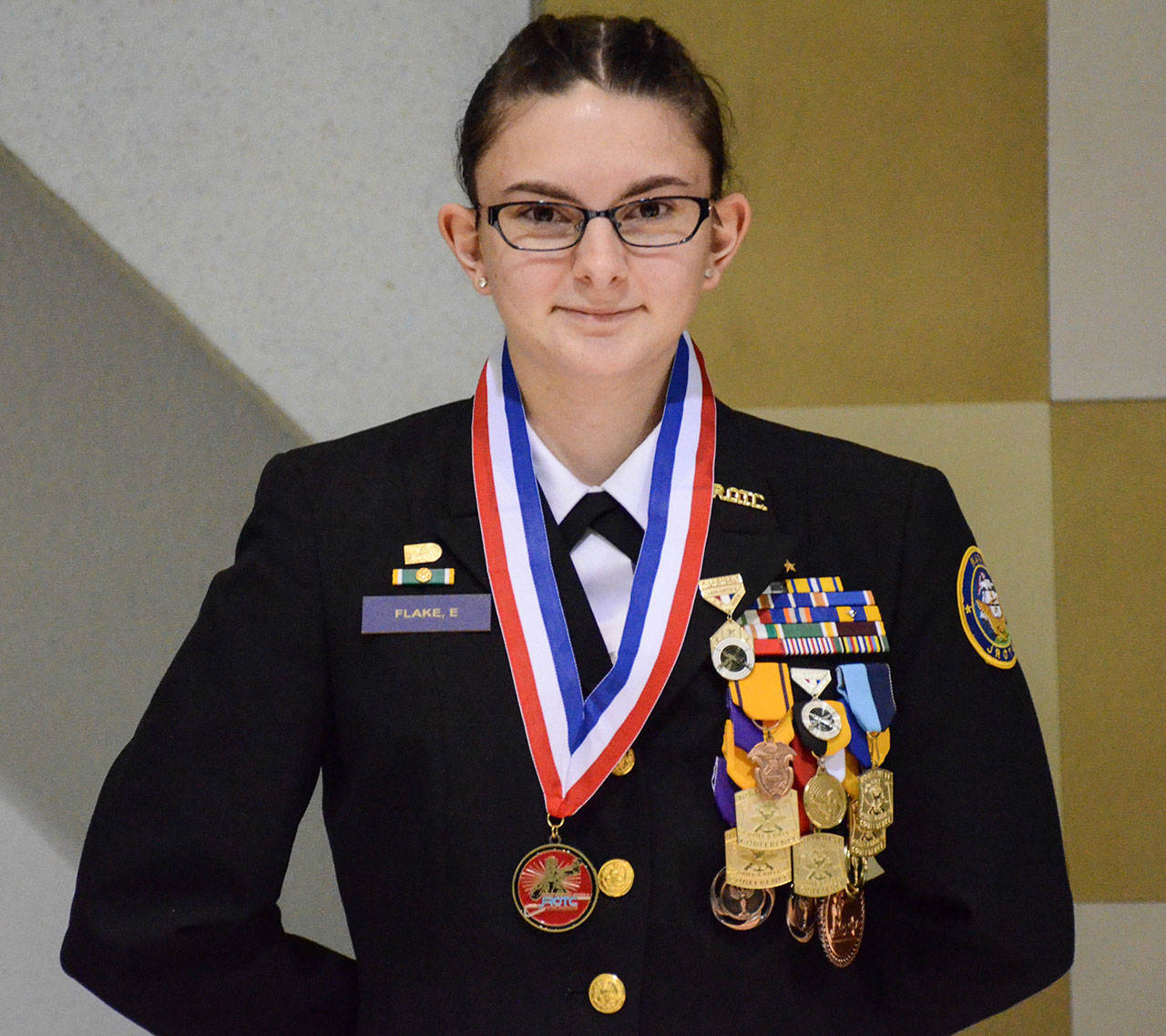 Elena Flake displays her medal from the national competition. (Photo by Civil Marksmanship Program)