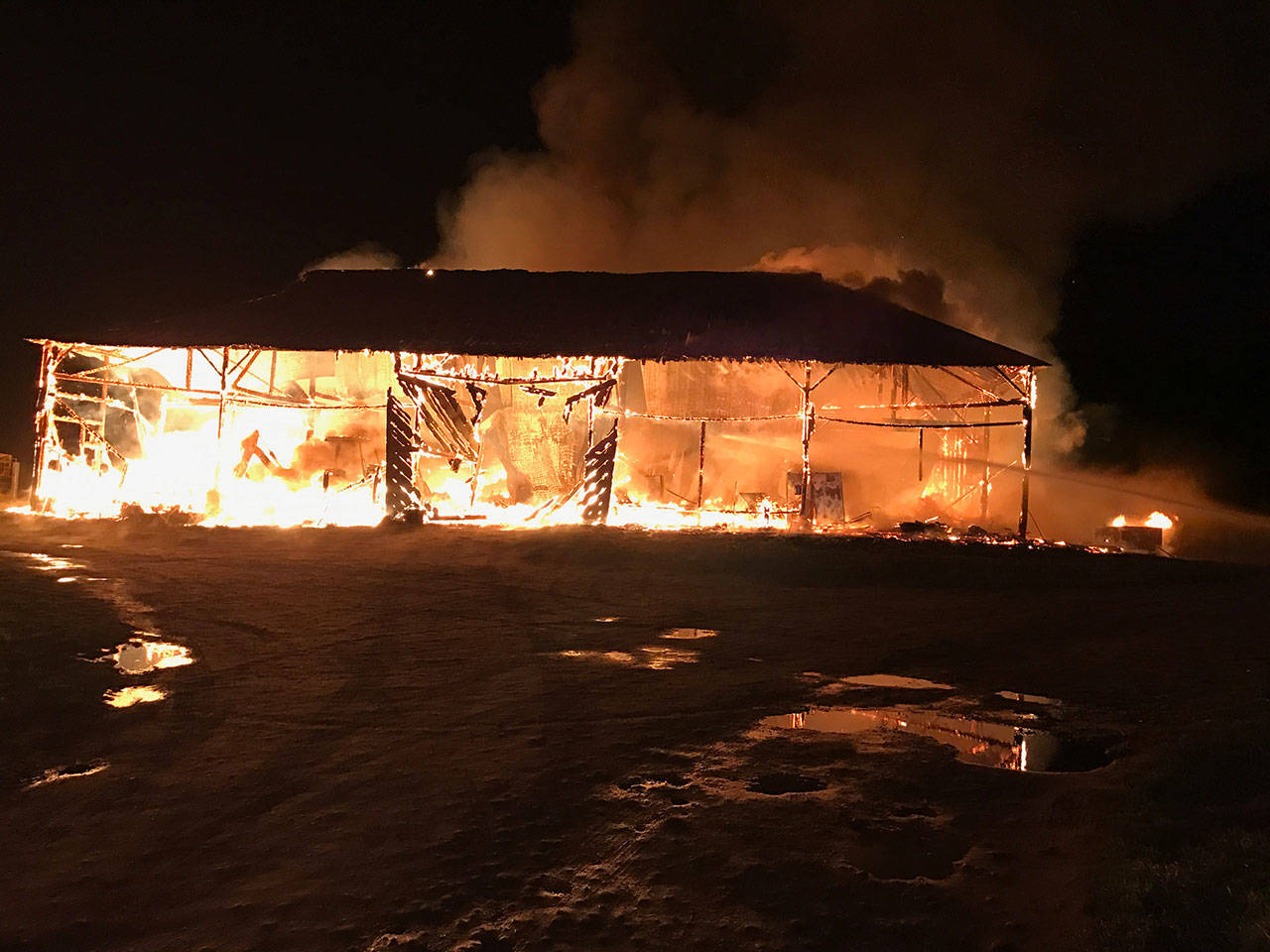 When Central Whidbey Fire & Rescue arrived on the scene, the barn was fully involved in flames Monday, March 6, 2017. Photo provided by Central Whidbey Fire & Rescue