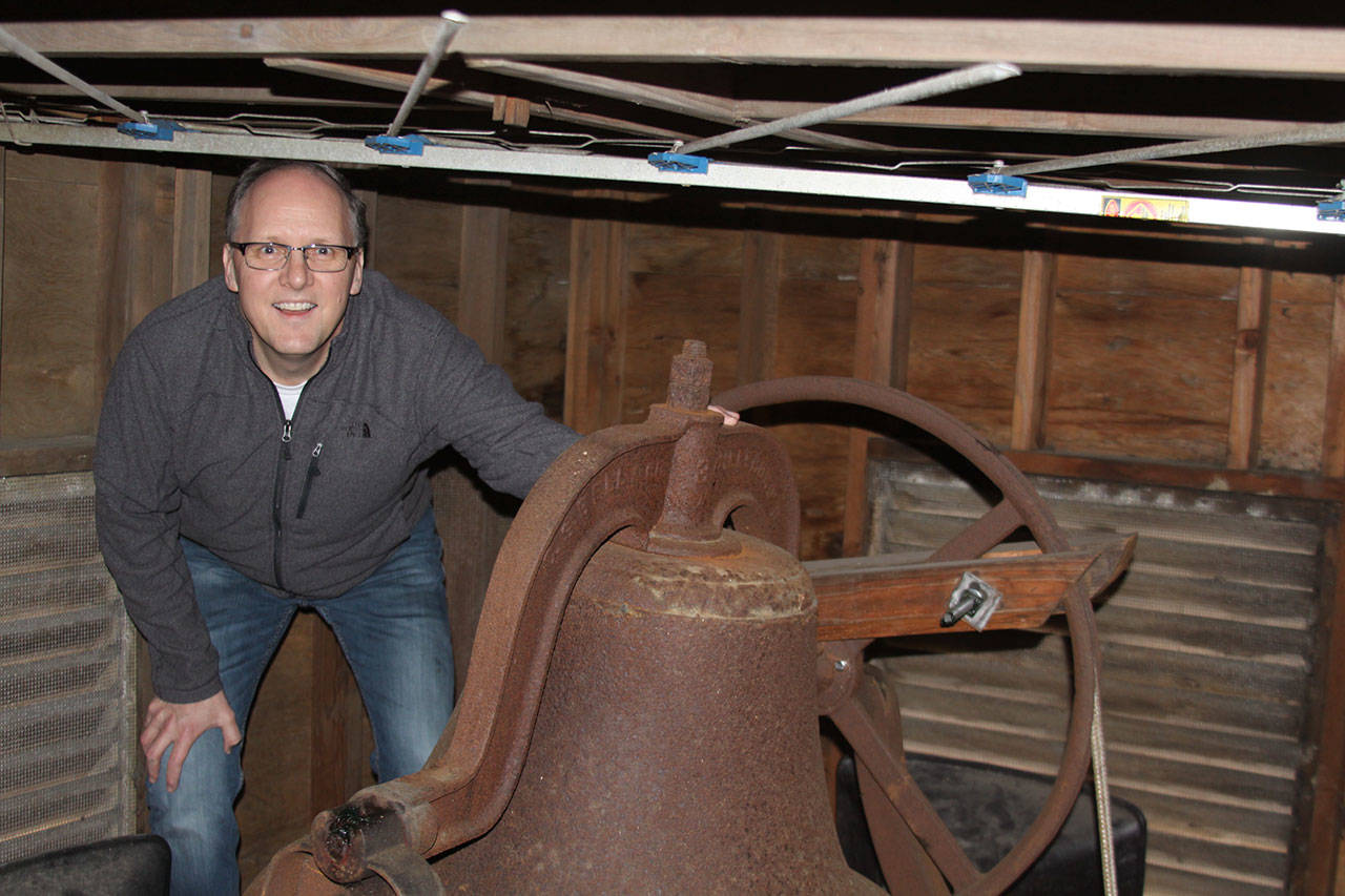 Pastor David Parker gets his first upclose look at the original bell in the belfry at Oak Harbor First United Methodist Church Thursday, March 9, 2017. Parker and his congregation are preparing for Sunday’s celebration of the church’s 125th anniversary. The old bell, the same one used when the church opened in Crescent Harbor in 1891, will be rung 125 times Sunday. Photo by Ron Newberry/Whidbey News-Times