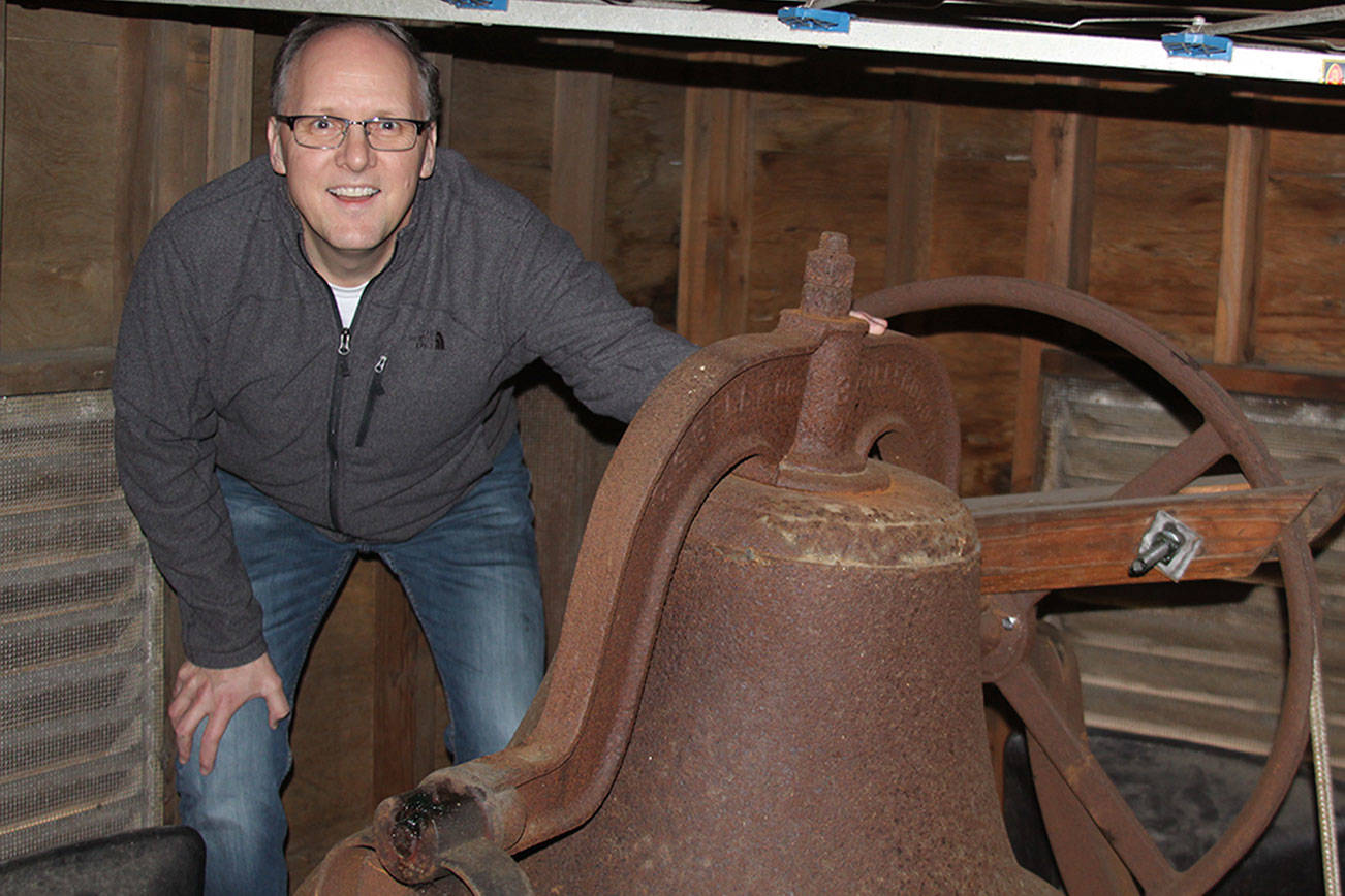 Pastor David Parker gets his first upclose look at the original bell in the belfry at Oak Harbor First United Methodist Church Thursday, March 9, 2017. Parker and his congregation are preparing for Sunday’s celebration of the church’s 125th anniversary. The old bell, the same one used when the church opened in Crescent Harbor in 1891, will be rung 125 times Sunday. Photo by Ron Newberry/Whidbey News-Times