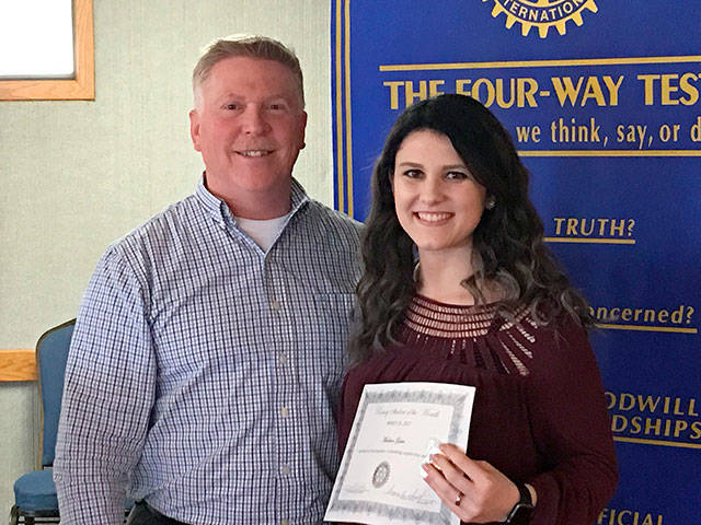 Rotary Club of Oak Harbor President Greg Smith presents Madison Gaber with a certificate. Photo provided
