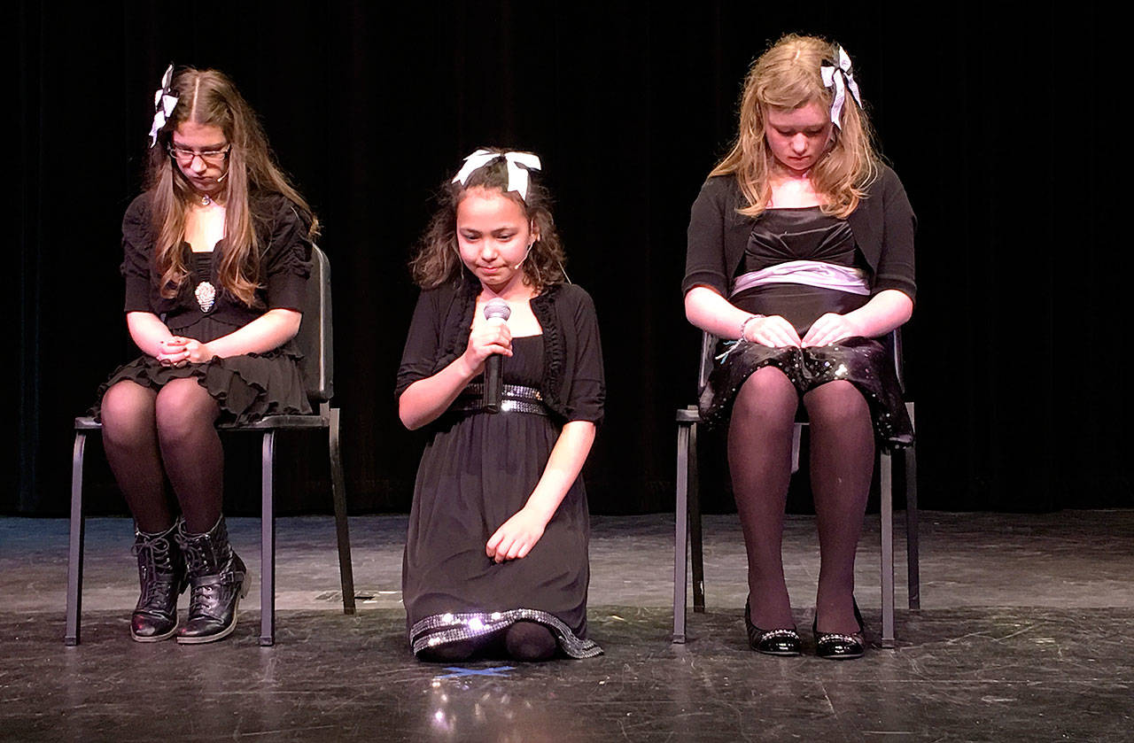 The Melodys, the people’s choice winners of the presentation division, Meekah Amadio, Samantha Brinker and Megan Cantrell, respectively, perform Sunday at Oak Harbor High School in Whidbey Has Talent. Photo by Daniel Warn/Whidbey News-Times