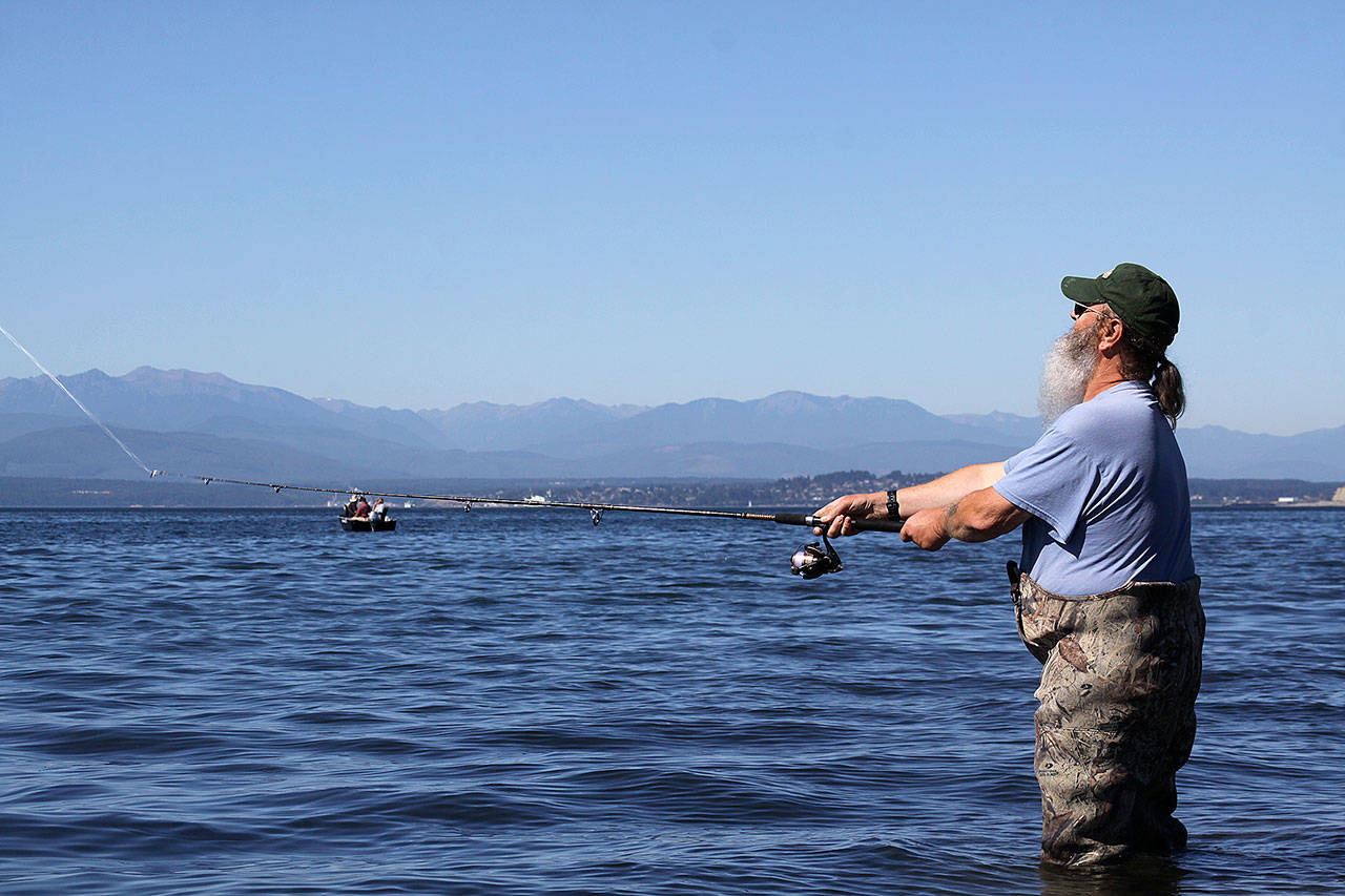 Oak Harbor&rsquo;s Keith Glass casts for pink salmon in the summer of 2015. Opportunities for catching salmon will be slightly improved in some areas around Whidbey Island and restricted all together in others. The 2017 salmon seasons were released this week by the Washington Department of Fish and Wildlife. Photos by Ron Newberry/Whidbey News-Times