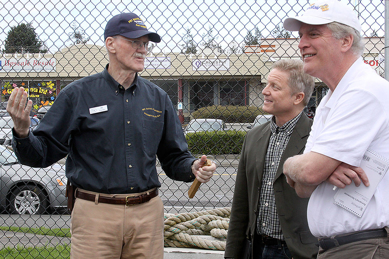Wil Shellenberger, left, president of the PBY Memorial Foundation, speaks with on-air personalities Jim Dever of KING 5’s Evening Magazine and Mark Christopher during a tour of the PBY-Naval Air Museum in Oak Harbor Thursday, April 6. Christopher, whose father was a PBY pilot during World War II, will emcee the museum’s Celebration of Flight Dinner and Auction Saturday, May 20 at the Oak Harbor Elks Lodge. Dever will serve as the auctioneer. Photo by Ron Newberry/Whidbey News-Times