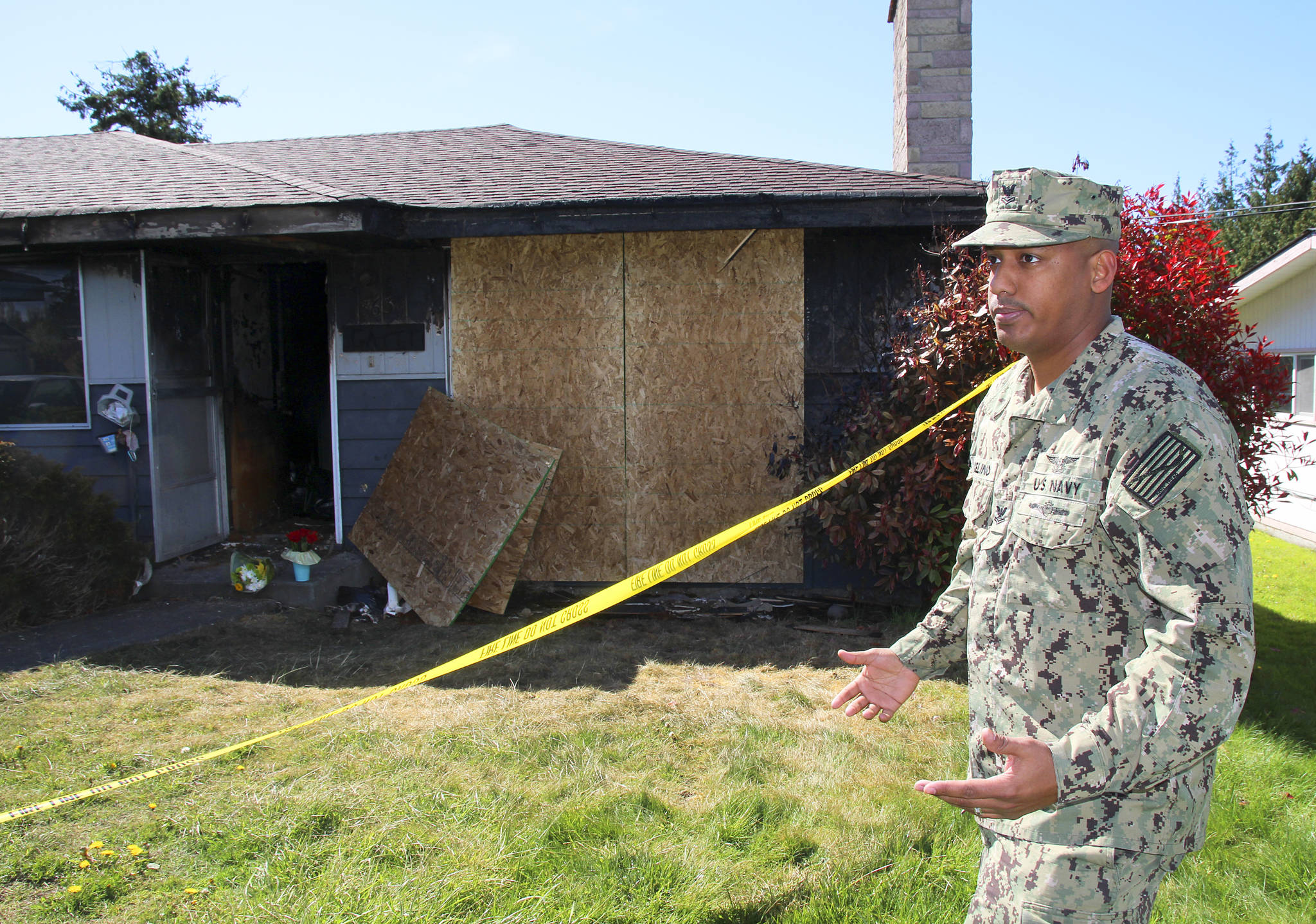 Photo by Jessie Stensland / Whidbey News-Times                                Michael Marcelino, a Navy logistics specialist with VP-1, speaks about his response to a fire in Oak Harbor Tuesday night that killed a man and injured a woman.