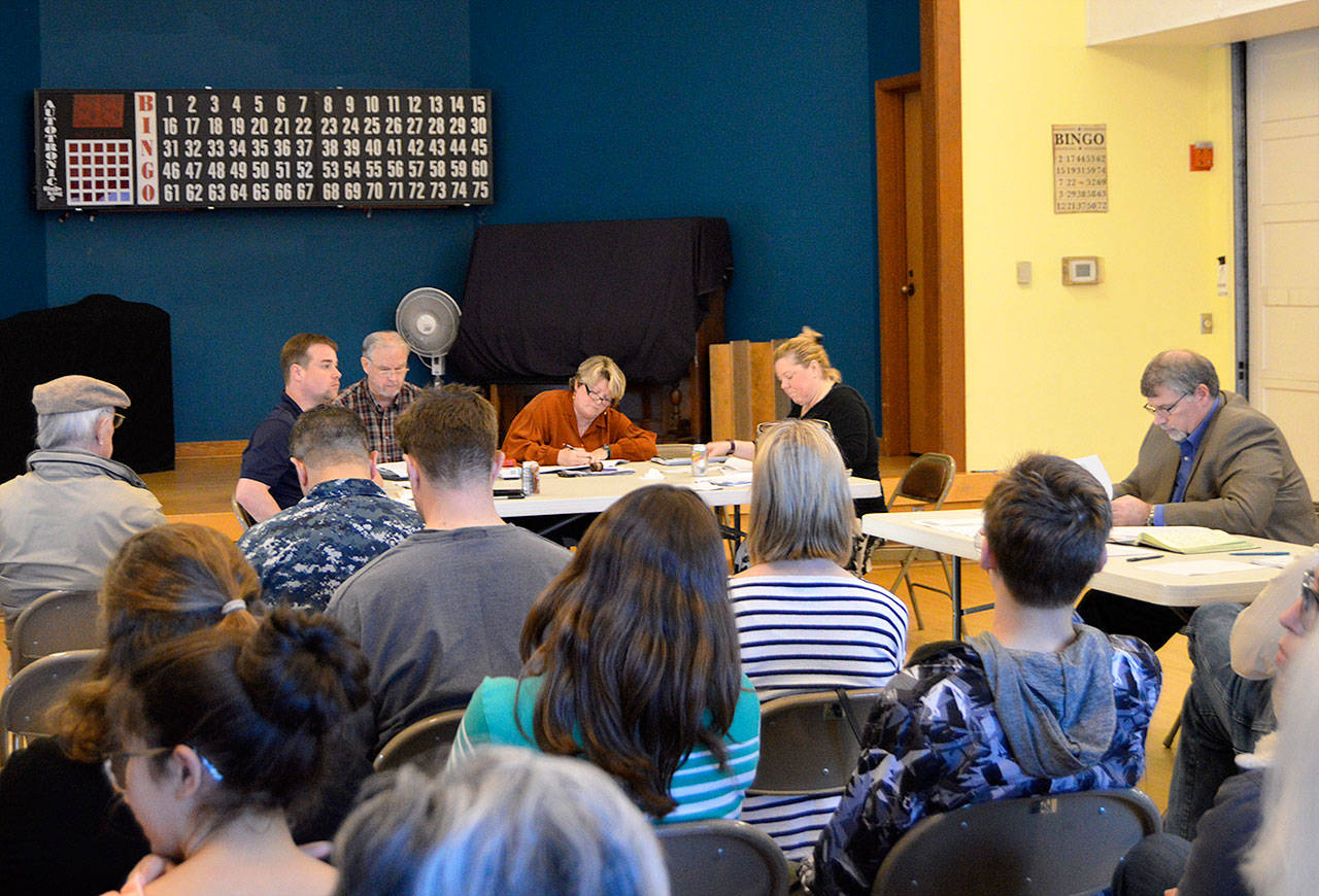 The North Whidbey Park and Recreation District Board of Commissioners met Tuesday before a large crowd of swim club supporters. At one point the meeting was recessed after an angry parent slammed his fists on the board table. Photo by Megan Hansen/Whidbey News-Times