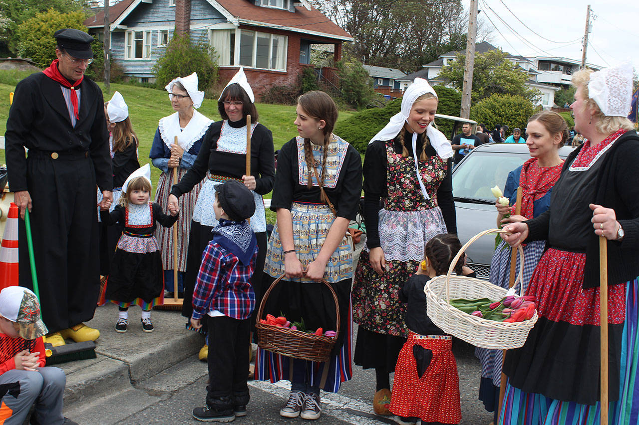 Street sweepers and tulip tossers, dressed in traditional Dutch clothing, get ready to start Saturday’s Grand Parade of the 48th annual Holland Happening. Photos by Patricia Guthrie/Whidbey News-Times