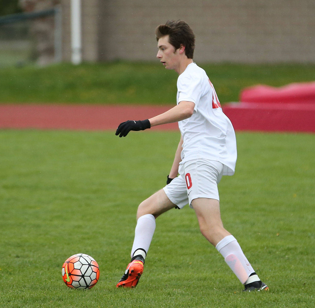 Nick Dion looks to pass for the Wolves. (Photo by John Fisken)