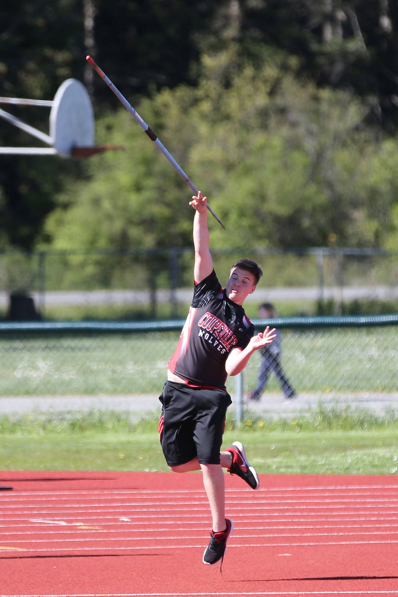 Jacob Martin hurls the javelin in Monday’s meet. (Photo by John Fisken)