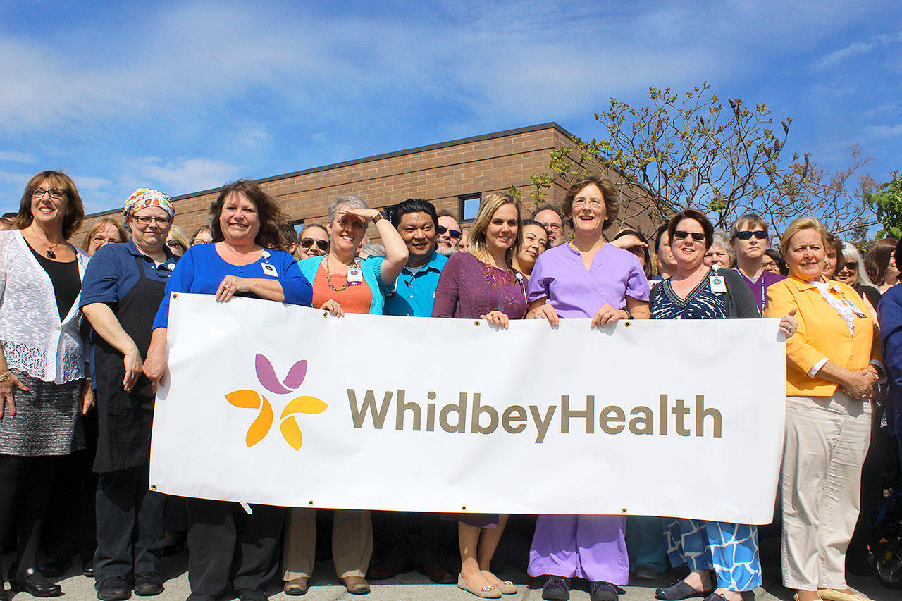 The staff of WhidbeyHealth Medical Center and CEO Geri Forbes (far left) gather for a group photo during Healthcare Week that recognized nearly 800 employees. Coupeville panorama photographer Denis Hill took photos using a telescoping pole. Photo by Patricia Guthrie/Whidbey News-Times