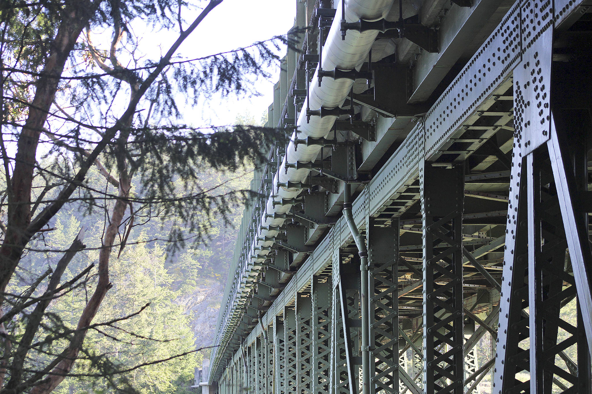 Photo by Jessie Stensland/Whidbey News-Times                                A project to replace the hangers on a water pipe under Deception Pass Bridge will take longer than expected.