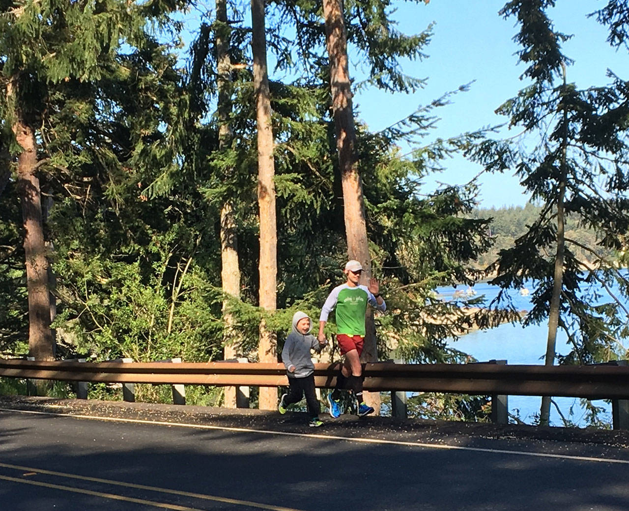 Son Jackson joins Justin Roberts for some of the run down the length of Whidbey Island. (Photo by Andrea Roberts)