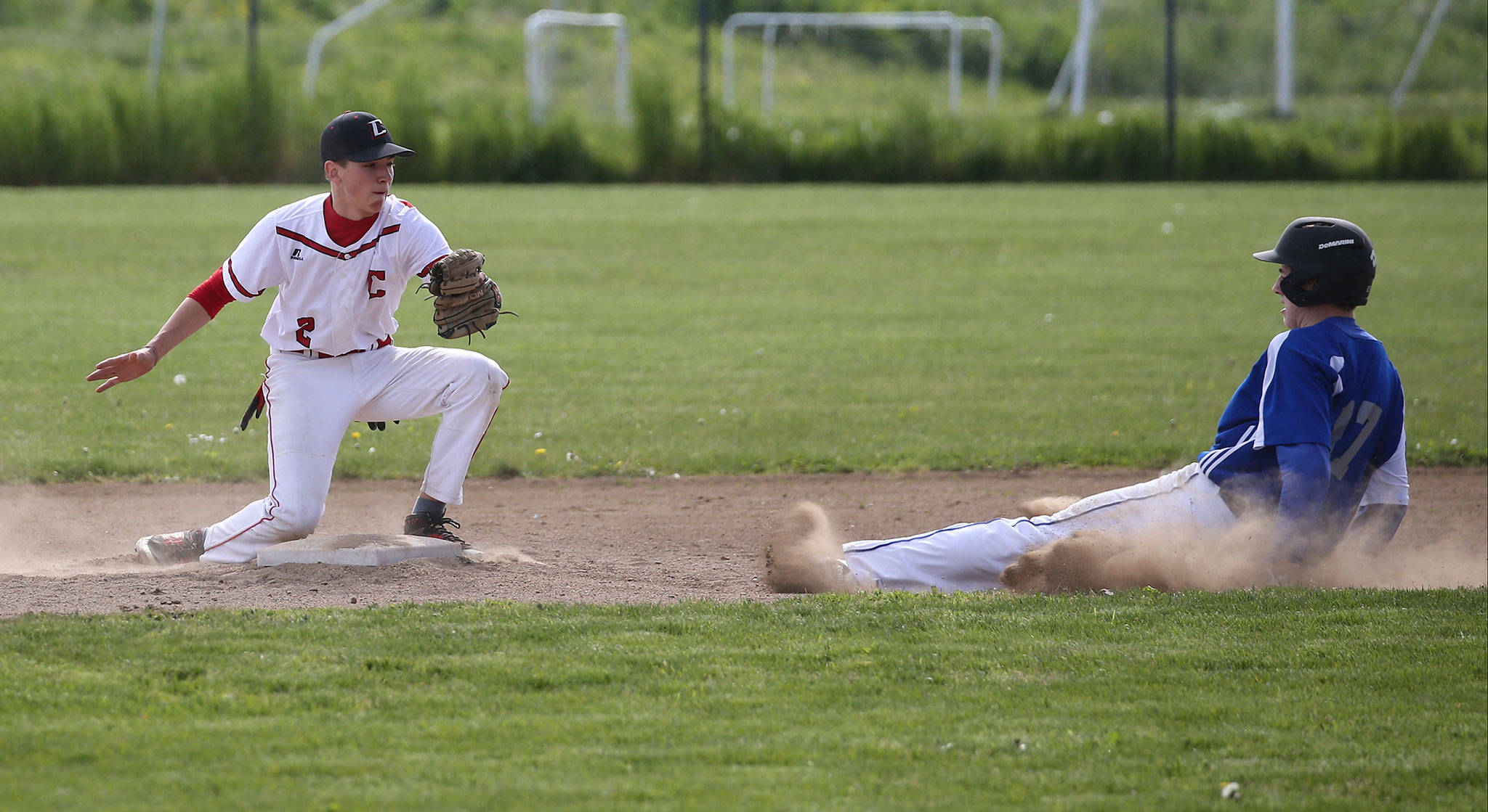 Nick Etzell attempts to take out BC’s Jeff Jewett on a stolen base. (Photo by John Fisken)