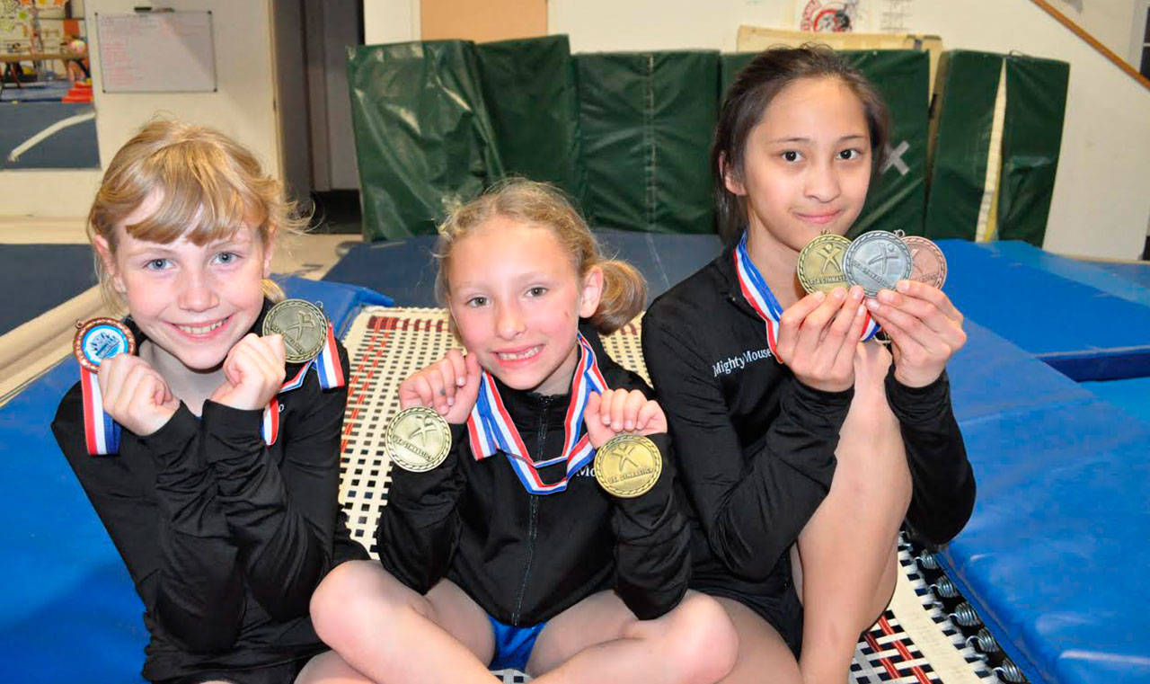 Ground Zero&rsquo;s Allison Lovett, left, Heidi Mullans and Kaia Crebbin are all smiles and medals after competing in the regional tournament in Las Vegas. (Submitted photo)
