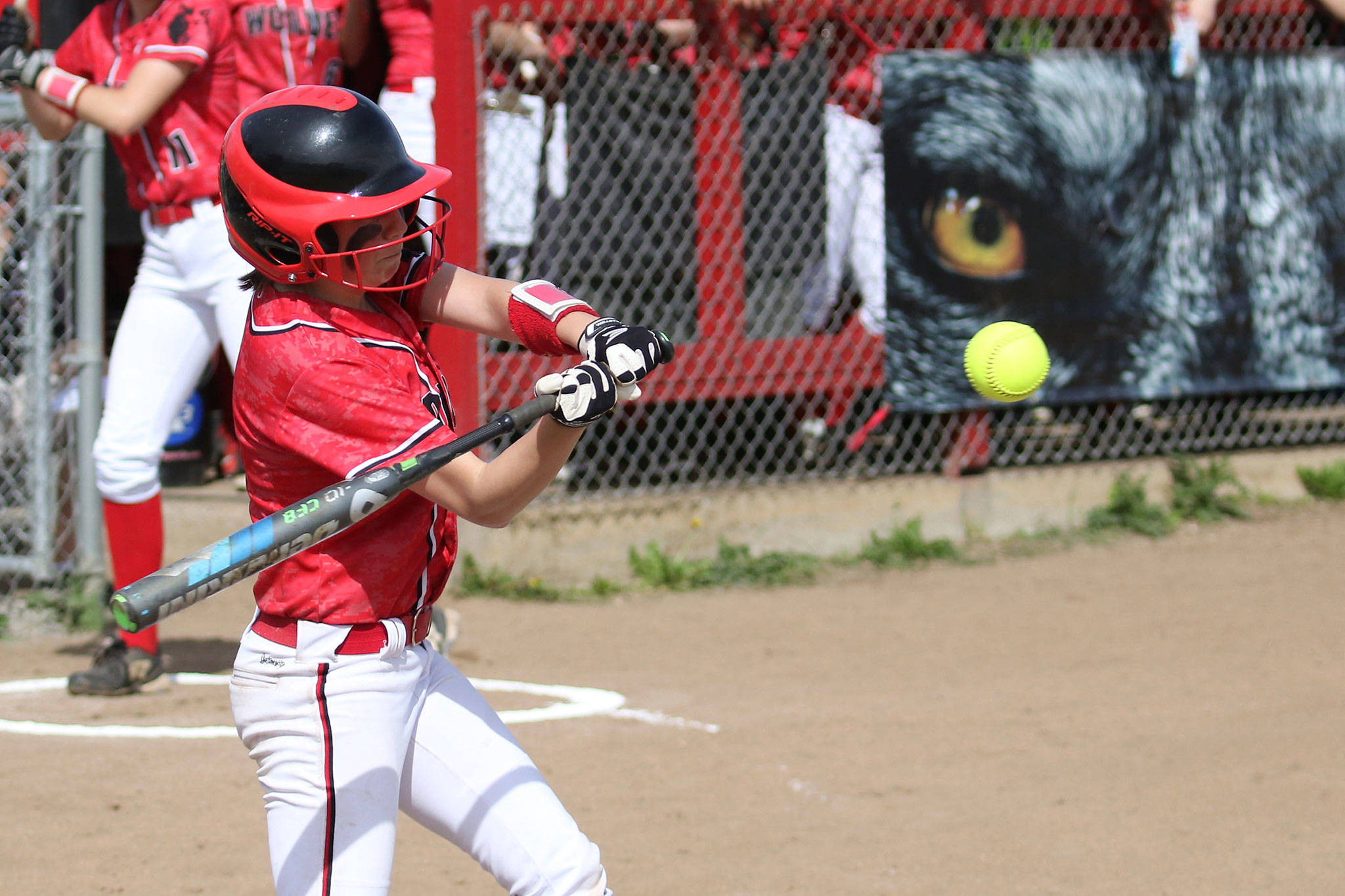 Senior Jae LeVine goes after a pitch in her final home game. (Photo by John Fisken)