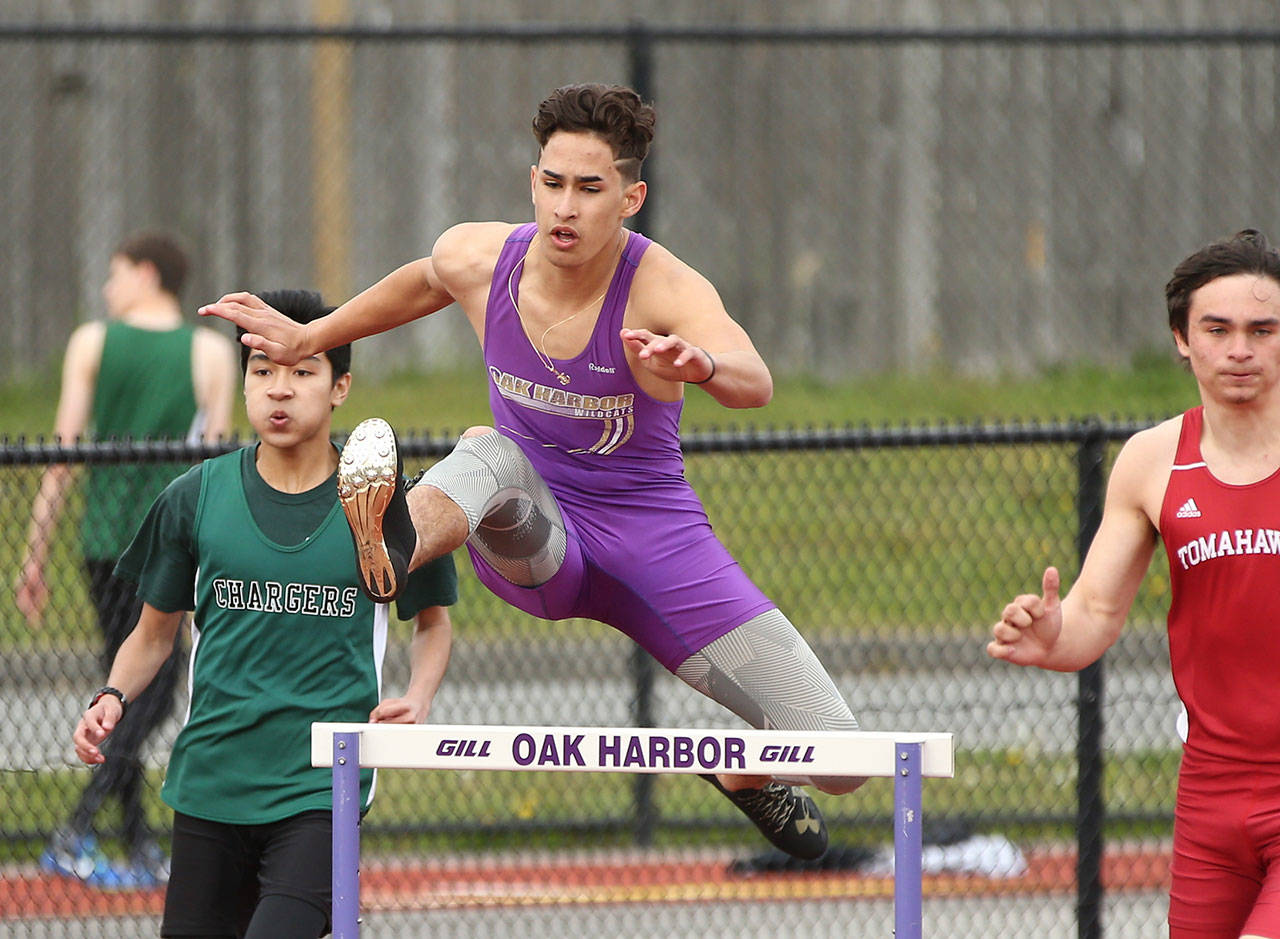 Aaron Fletcher races to second place in the 300 hurdles Tuesday. He also won the JV 110 high hurdles. (Photo by John Fisken)