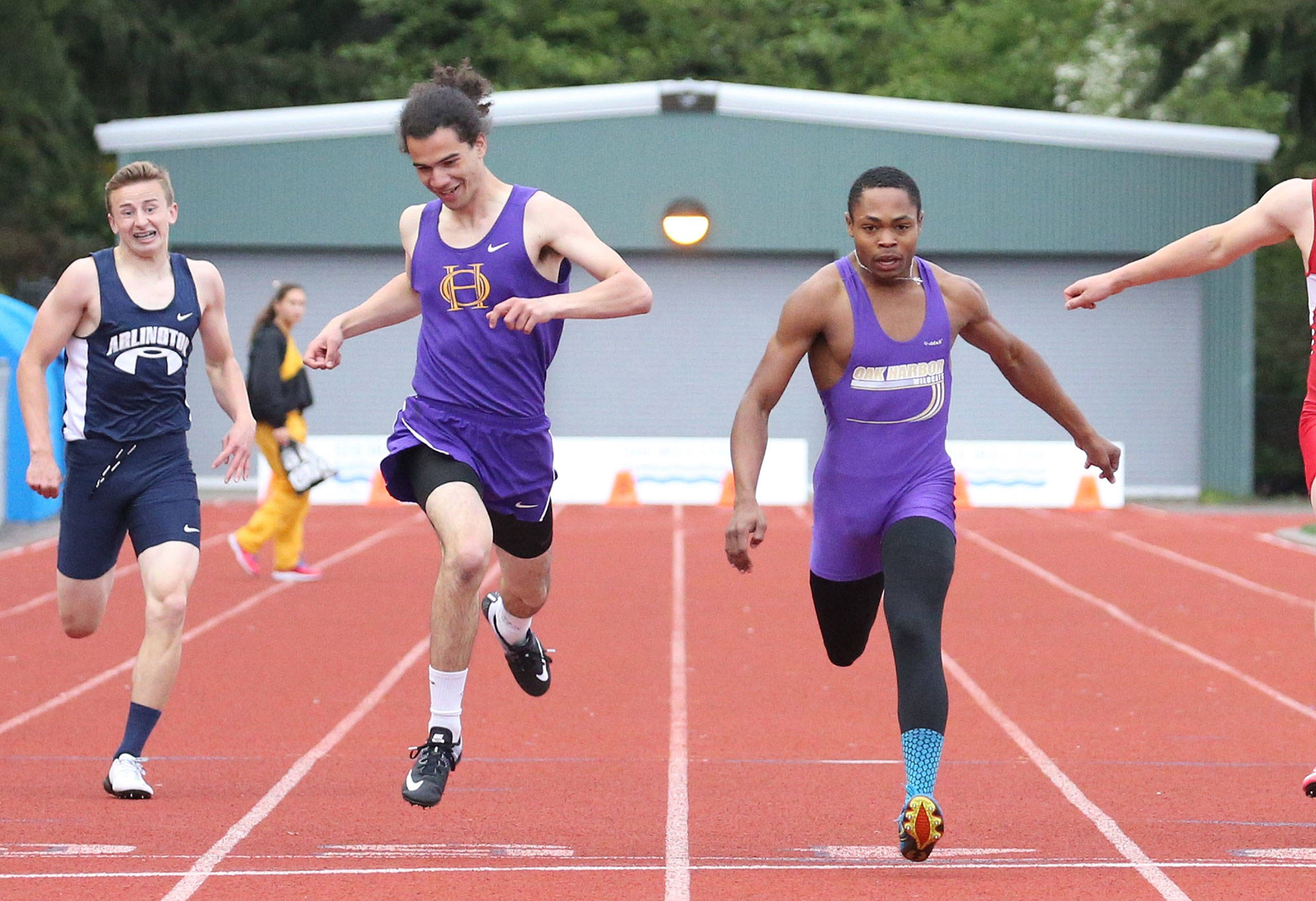 Oak Harbor’s Chris Brown, right, edges teammate Miguel Guzman for the 400-meter final. (Photo by John Fisken)