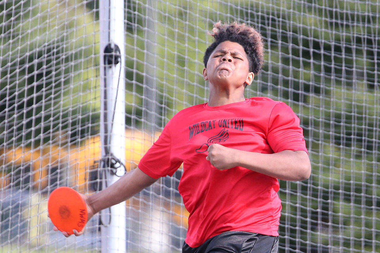 Kanye Kitchens tosses the discus for Wildcat United. He finished second in the event and won the shot put. (Photo by John Fisken)