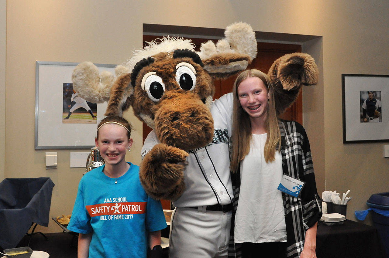 Broad View Elementary 5th grader Carly VanGiesen, left, poses with the Mariners Moose at Safeco Field, where she was inducted into the 2017 AAA School Safety Patrol Hall of Fame May 20. Photo provided.