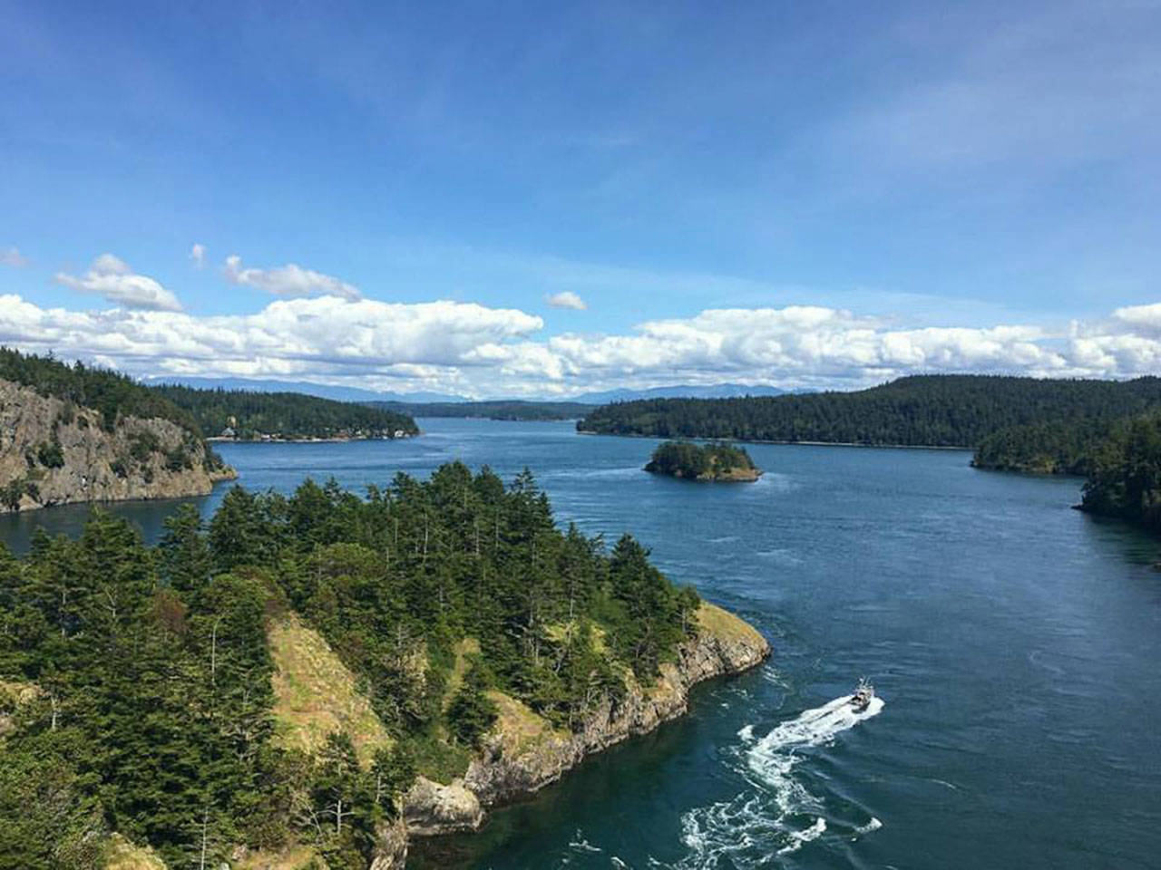 Check out this view from Deception pass bridge as a boat zips through the waters below on a sunny June 2. Photo by Anne TePaske