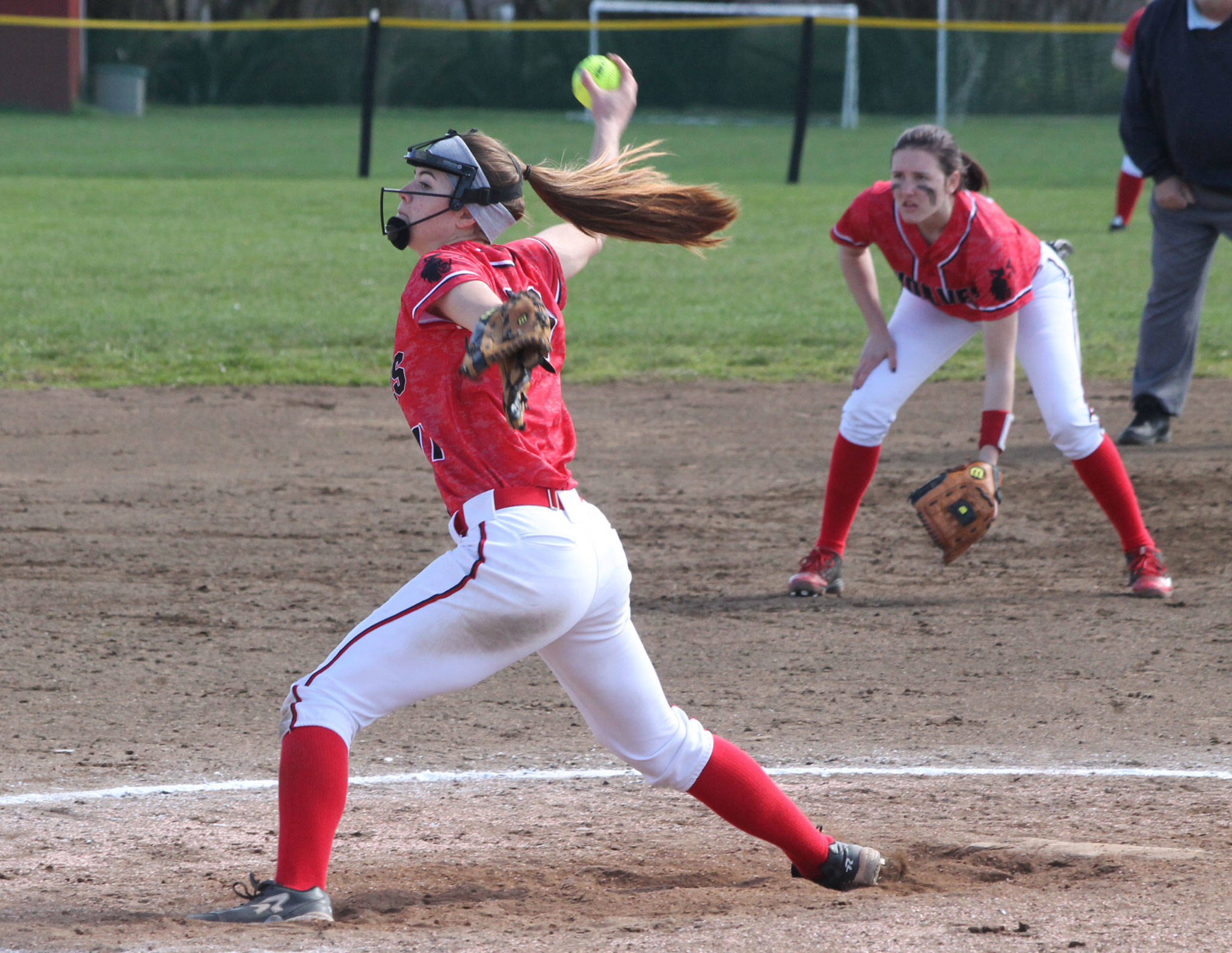 Coupeville pitcher Katrina McGranahan was named the Olympic League’s co-MVP this spring. Shortstop Mikayla Elfrank, in the background, was another first-team selection for the Wolves. (Photo by Jim Waller/Whidbey News-Times)