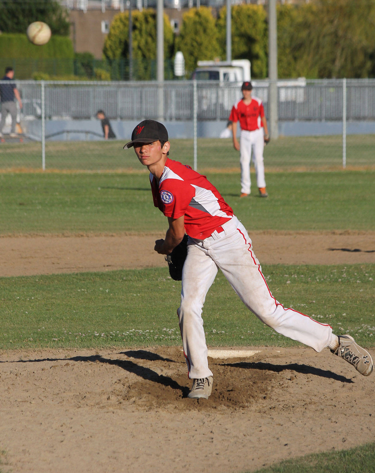 Hawthorne Wolfe lets a pitch fly in Monday’s district tournament game. (Photo by Jim Waller/Whidbey News-Times)