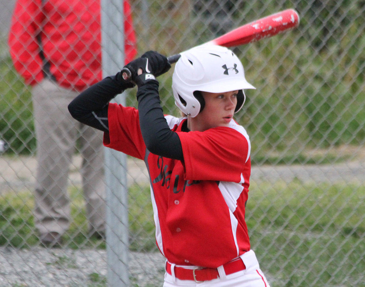 Chelsea Prescott focuses on the next pitch in a recent Babe Ruth game. (Photo by Jim Waller/Whidbey News-Times)