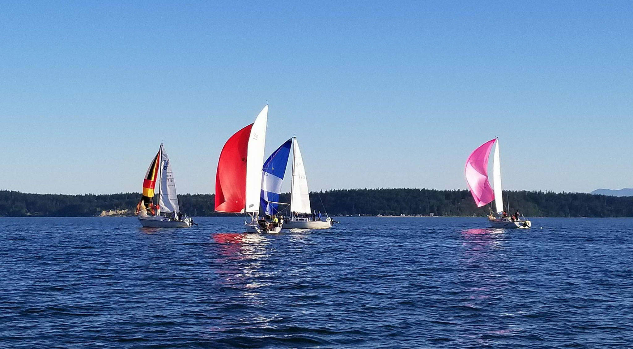 Boats compete in the Oak Harbor Yacht Club Sailing Fleet Thursday night races this week. Several of the local boats will take part in the North American San Juan 24 Championships here this weekend. (Photo Ryan Nowicki)