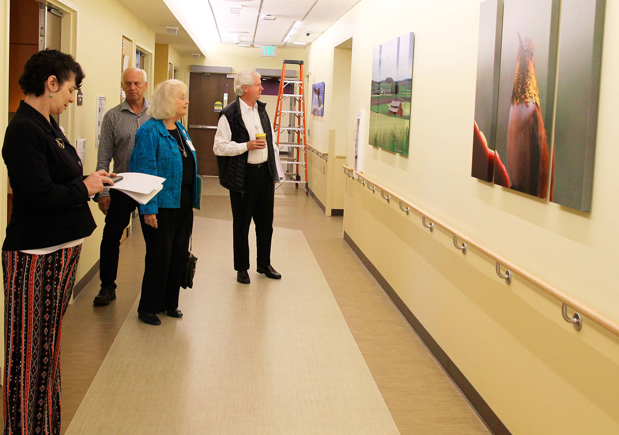 WhidbeyHealth media liason Patricia Duff (far left) takes board commissioners Ron Wallin (left) Nancyjean Fey (center) and Kurt Blankenship on a tour of WhidbeyHealth’s new patient wing. It is scheduled to open next week. Photo by Patricia Guthrie/Whidbey News-Times