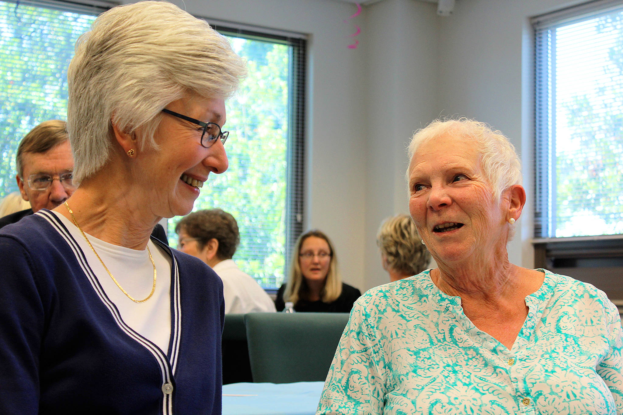 Carla Grau-Egerton (left) congratulates Joan Caldwell of Coupeville for 30 years of service as a Court Appointed Special Advocate. Caldwell represented the interests of 80 children removed from homes because of abuse allegations over the past three decades.                                Photo by Patricia Guthrie/Whidbey News-Times