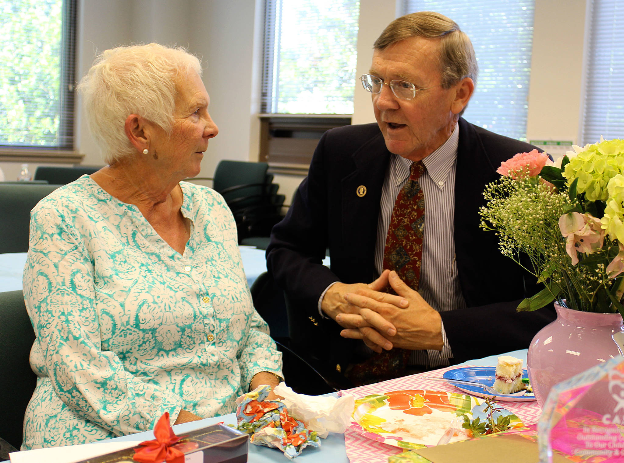 Joan Caldwell chats with Superior Court Judge Alan Hancock at a retirement party recognizing Caldwell’s long service as a volunteer for CASA, a program that advocates for children who have been removed from homes because of abuse or neglect allegations. A service award in her honor was established. Photo by Patricia Guthrie/Whidbey News Times