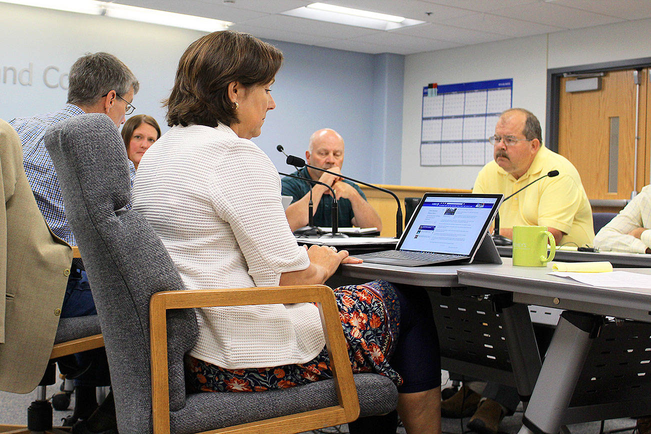How to close 80 open cases of building and other code violations is discussed by county commissioners and planning, health and human services, law enforcement and legal staff at a recent work session of Island County Board of Commissioners.