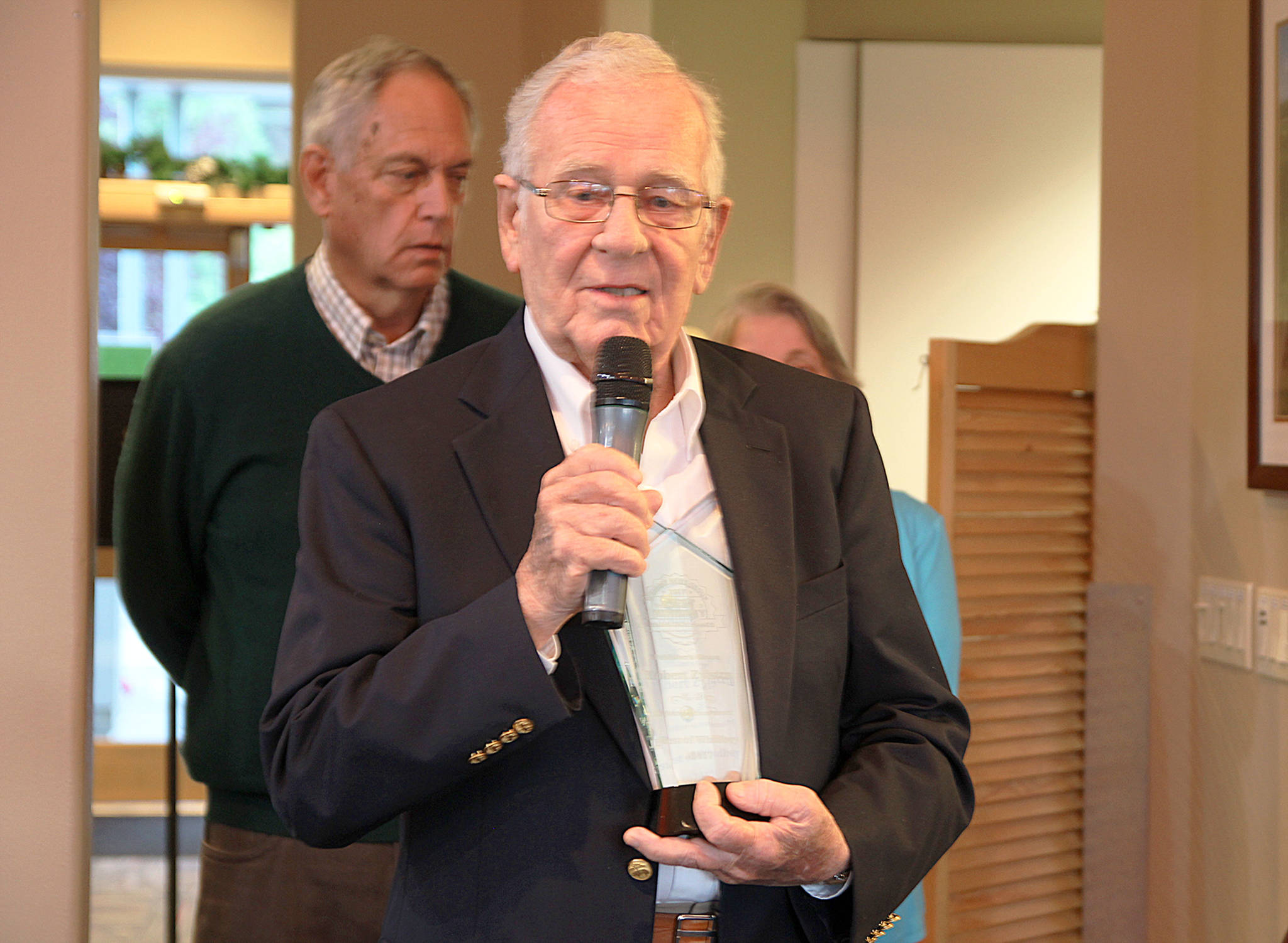 Bob Zylstra accepts the Publisher’s Award for Lifetime Achievement during the Best of Whidbey Banquet Thursday, July 27. Photo by Megan Hansen/Whidbey News-Time