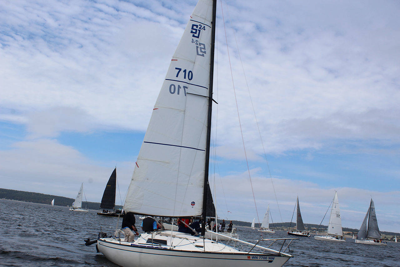 Bill and Cathy Walker sail Ehu Kai (710) to second place in their class. (Photo by Patricia Guthrie)