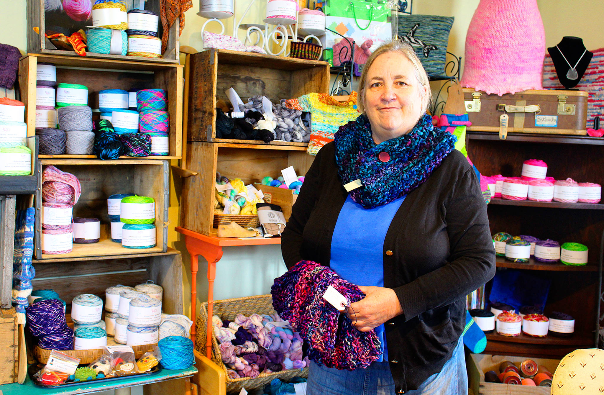 Dena Royal, owner of Whidbey Isle Yarns, Gifts and Teas, wears one of the many creations she makes that she&rsquo;ll be selling at a booth at the Coupeville Arts & Crafts Festival this weekend. Photo by Patricia Guthrie/Whidbey News-Times
