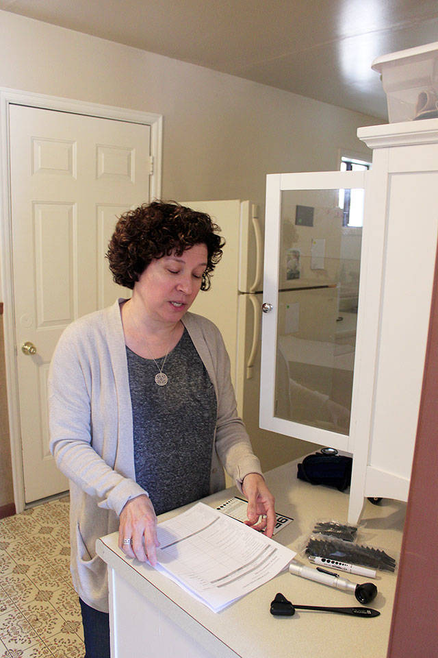Family nurse practioner Theresa Granger at the new small health clinic at Ryan&rsquo;s House for Youth. It offers basic medical services for at-risk youth and school sports physicial for all local youth.                                Photo by Patricia Guthrie/Whidbey News-Times