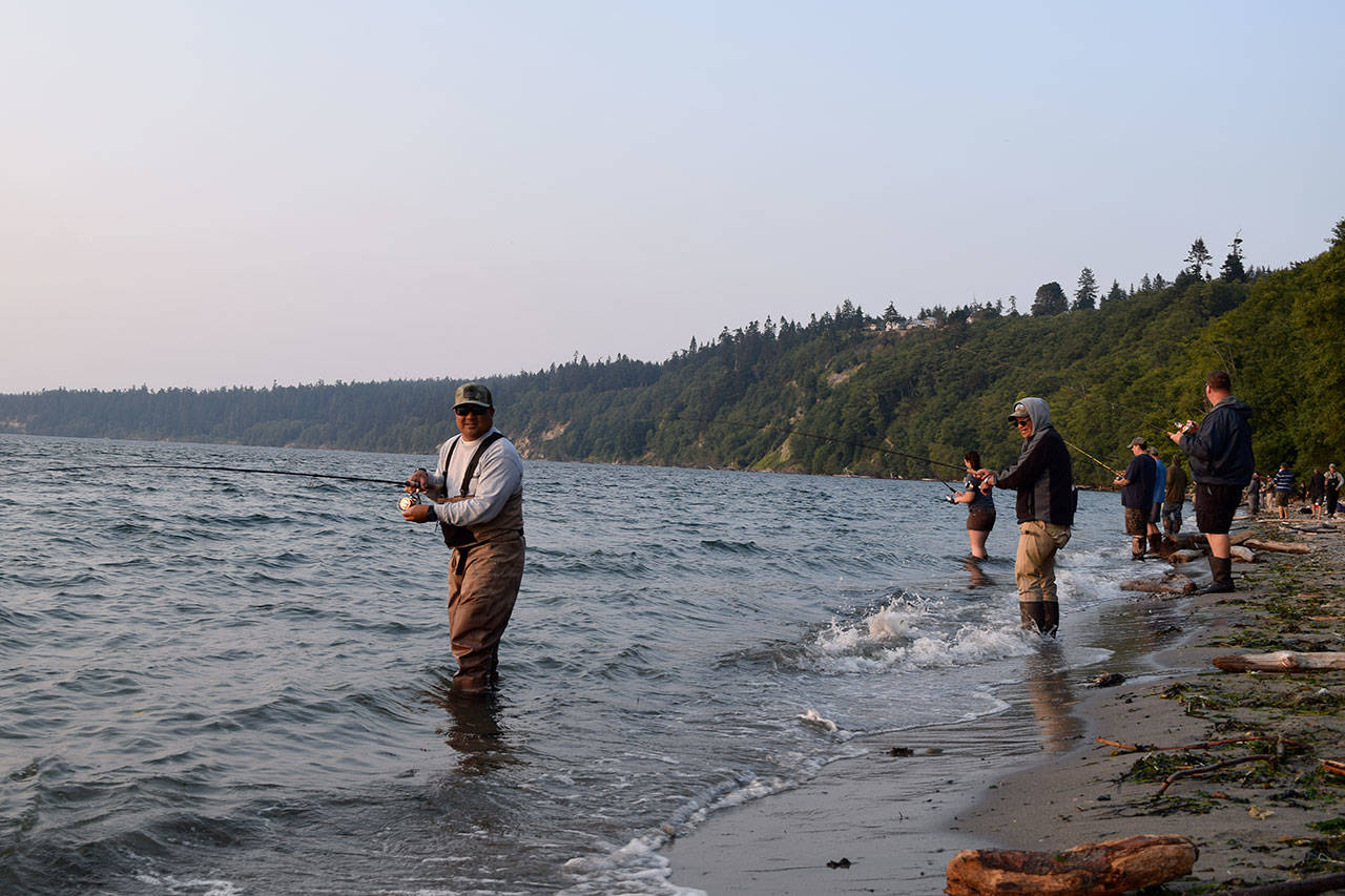 Kyle Jensen / The Record — Anglers aim to reel in pinks and hatchery coho at Bush Point.